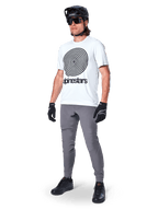 Alpinestars A-Dura Pants, MTB Pants, Dark Gray, worn with white spiral graphic t-shirt, black MTB helmet, sunglasses, and black gloves, durable 2-way stretch textile for off-road cycling