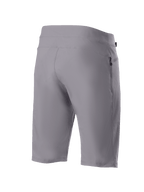 Shorts Alpinestars A-Dura, shorts de ciclismo de montaña, gris oscuro, vista trasera en tres cuartos que muestra el tejido elástico duradero en dos direcciones y el bolsillo lateral con cremallera, ropa técnica de ciclismo
