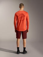 Jersey naranja A-Dura Air LS y pantalones cortos Ride Bordeaux, vista trasera de equipamiento MTB de Alpinestars.