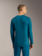 Jersey Alpinestars A-Dura Ride azul verde de manga larga, diseño de cola extendida y logo para rendimiento en MTB.