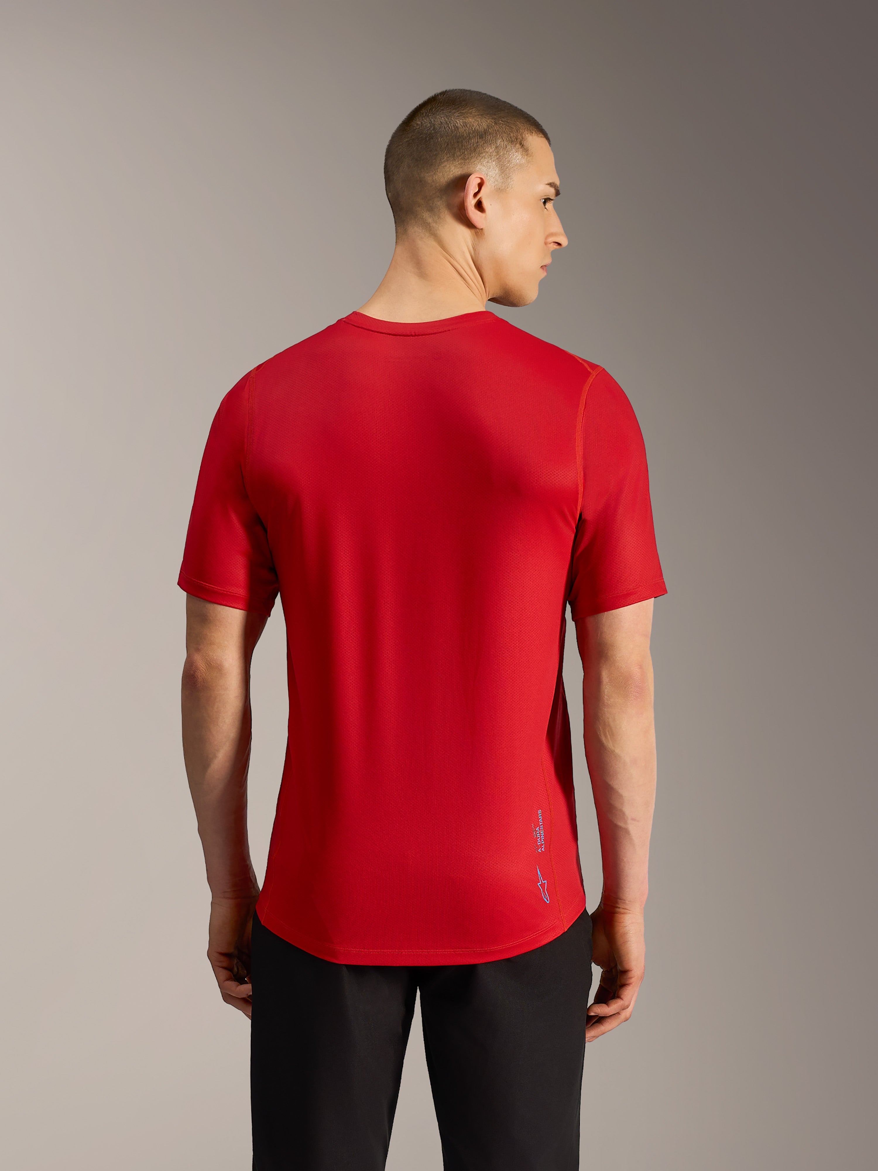 Red A-Dura Ride Short Sleeve MTB Jersey, back view with performance jacquard fabric, dropped tail, and subtle logo branding.