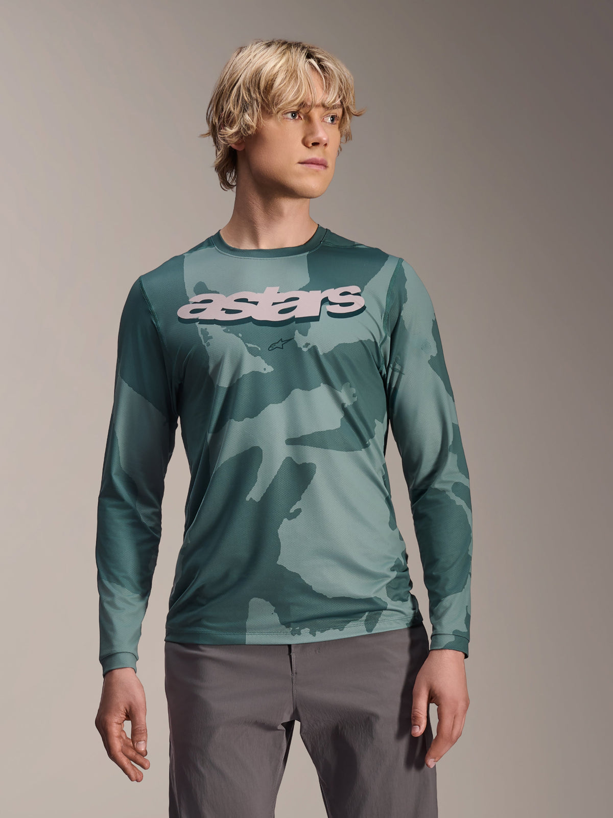 Alpinestars A-Dura Hollow Camo Long Sleeve Jersey, MTB Jersey, Silver Pine Camo green camouflage pattern, large light grey astars logo on chest, worn with grey pants, high-performance mountain biking apparel