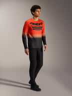 Camiseta de manga larga A-Dura ASTARS 2.0 naranja y negra con logo en el pecho para ciclismo de montaña.