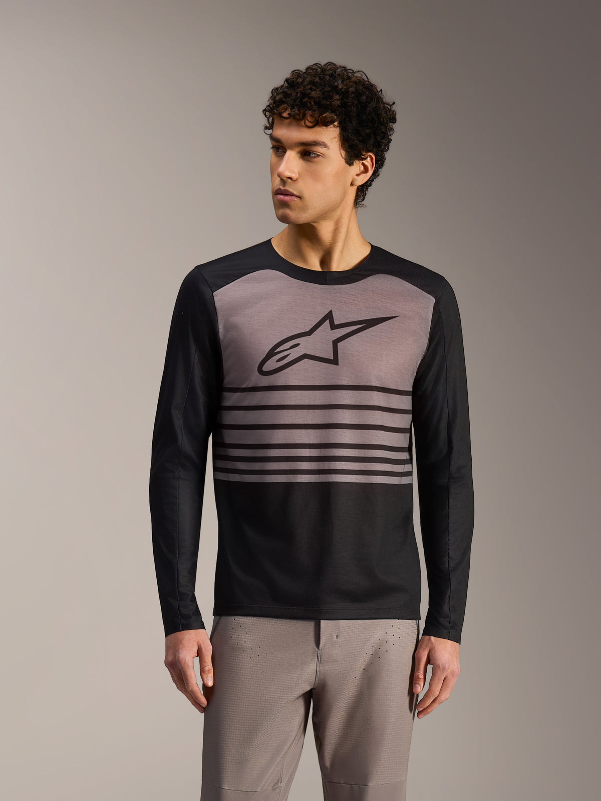 Camiseta Alpinestars A-Dura Elite 2.0 de manga larga, diseño MTB en bloques de color negro y gris con logotipo frontal.