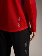 Camiseta roja A-Dura Elite 2.0 de manga larga y pantalones MTB negros con logotipos Alpinestars y tejido técnico.