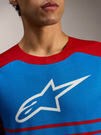 Jersey Alpinestars A-Dura Elite 2.0, camiseta de MTB azul y roja con logotipo de estrella blanca en el pecho.