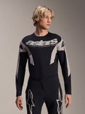 Alpinestars A-Supra Melt Jersey de manga larga, jersey para ciclismo de montaña MTB, negro y gris, con el gráfico 'astars' en el pecho y mangas estampadas, usado con pantalones de rendimiento a juego
