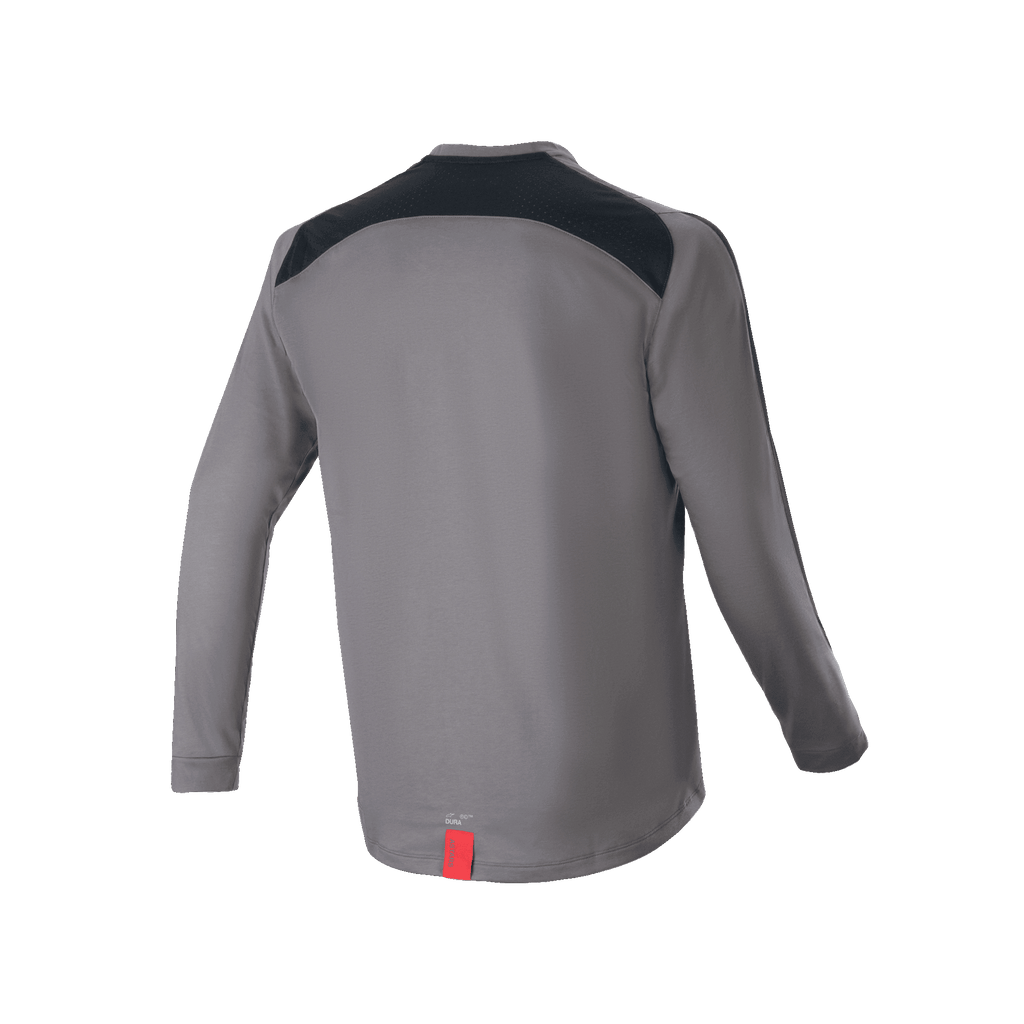 Jersey de manga larga Alpinestars A-Dura Dri Astar, gris oscuro, vista trasera con paneles de ventilación de malla negra en los hombros y una pequeña etiqueta roja en el dobladillo, ropa técnica para ciclismo de montaña
