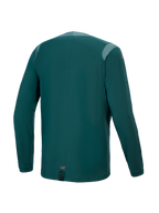 Alpinestars A-Dura Dri Wool Jersey - Manga Larga, color Dark Pine, vista trasera con paneles de malla en los hombros y el cuello, tejido técnico de mezcla de lana, parte trasera más larga para cobertura de MTB y pequeño detalle de marca naranja en el dobladillo inferior.