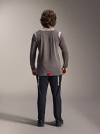 Alpinestars A-Dura Elite Pants and A-Dura Dri Wool Long Sleeve Jersey, Black pants with white branding, Grey technical jersey, rear view of mountain bike outfit, durable off-road cycling apparel