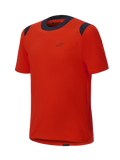 Jersey de manga corta Alpinestars A-Dura Dri Wool, color Spicy Orange con paneles de malla negros en el cuello y los hombros, diseño minimalista con un pequeño logotipo en el pecho, ropa técnica para bicicleta de montaña