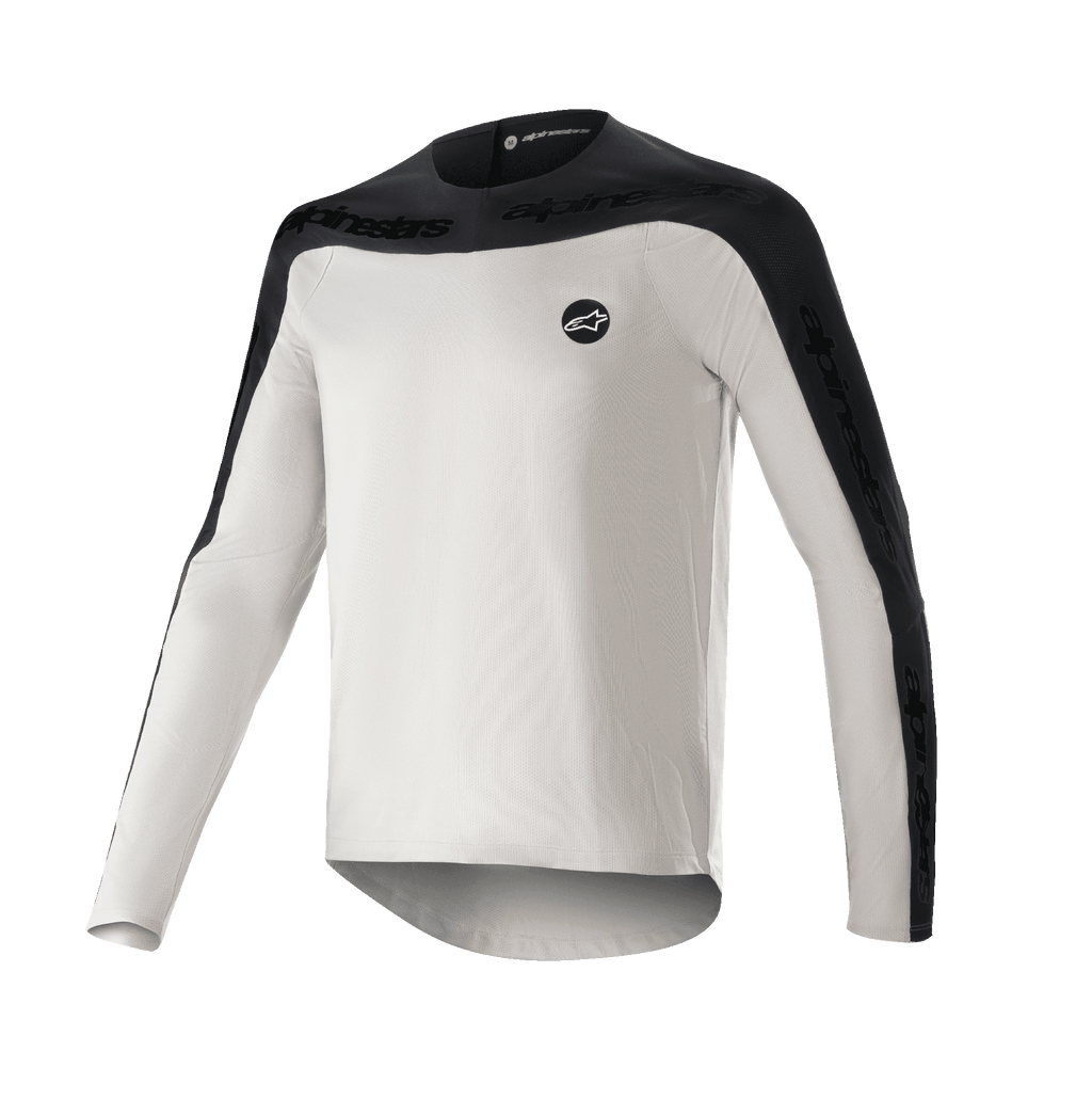 Alpinestars Drop Meta Jersey - Manga Larga, camiseta de MTB para ciclismo de montaña, gris claro y negro, con canesú negro en los hombros y paneles exteriores en las mangas con marca de texto, dobladillo trasero extendido para mayor cobertura y logo circular en el pecho izquierdo
