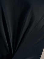 Tejido jacquard negro del Stella A-Dura Ride Jersey, destacando su textura transpirable y elasticidad de alto rendimiento.