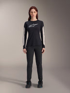 Alpinestars Women Stella A-Dura Pants, Black MTB Pants, featuring a dedicated women's fit with a streamlined design, paired with a black long-sleeve jersey and black cycling shoes, durable gear for off-road mountain biking