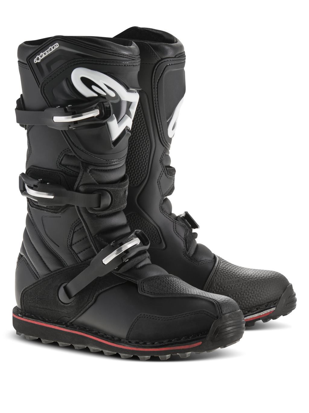 Botas Alpinestars Tech-T, botas de trial para motocicleta, negras con detalles en rojo y blanco, cuentan con un sistema de cierre de tres hebillas, espinillera ergonómica con el logo blanco de Astars, fina franja roja a lo largo de la suela, construcción de cuero duradero para trial y conducción off-road