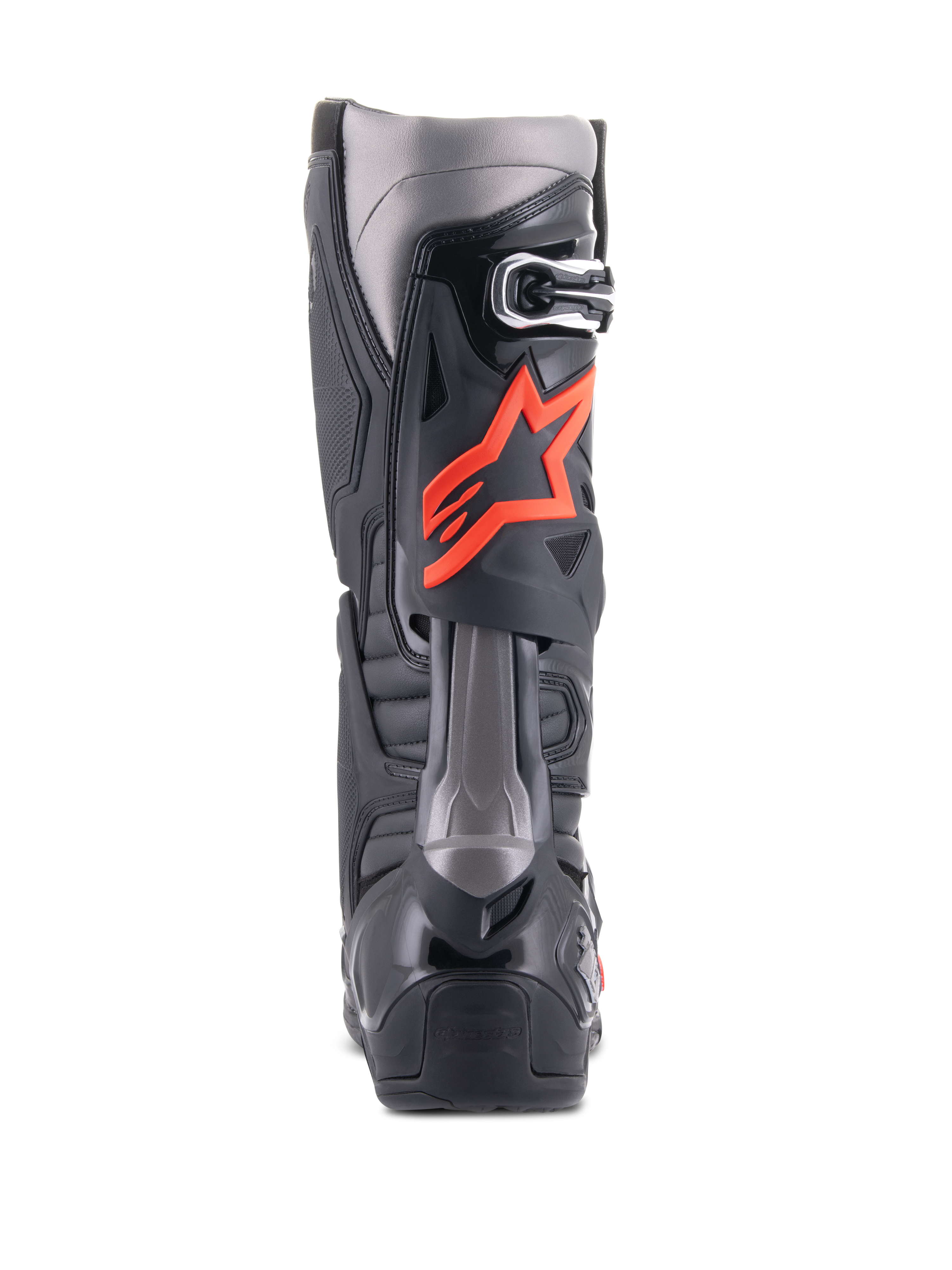 Botas Alpinestars Tech 10, botas de motocross, negro y rojo flúor, vista trasera con carcasa técnica de TPU, paneles gris oscuro y un prominente logotipo de estrella en rojo flúor en la pantorrilla.
