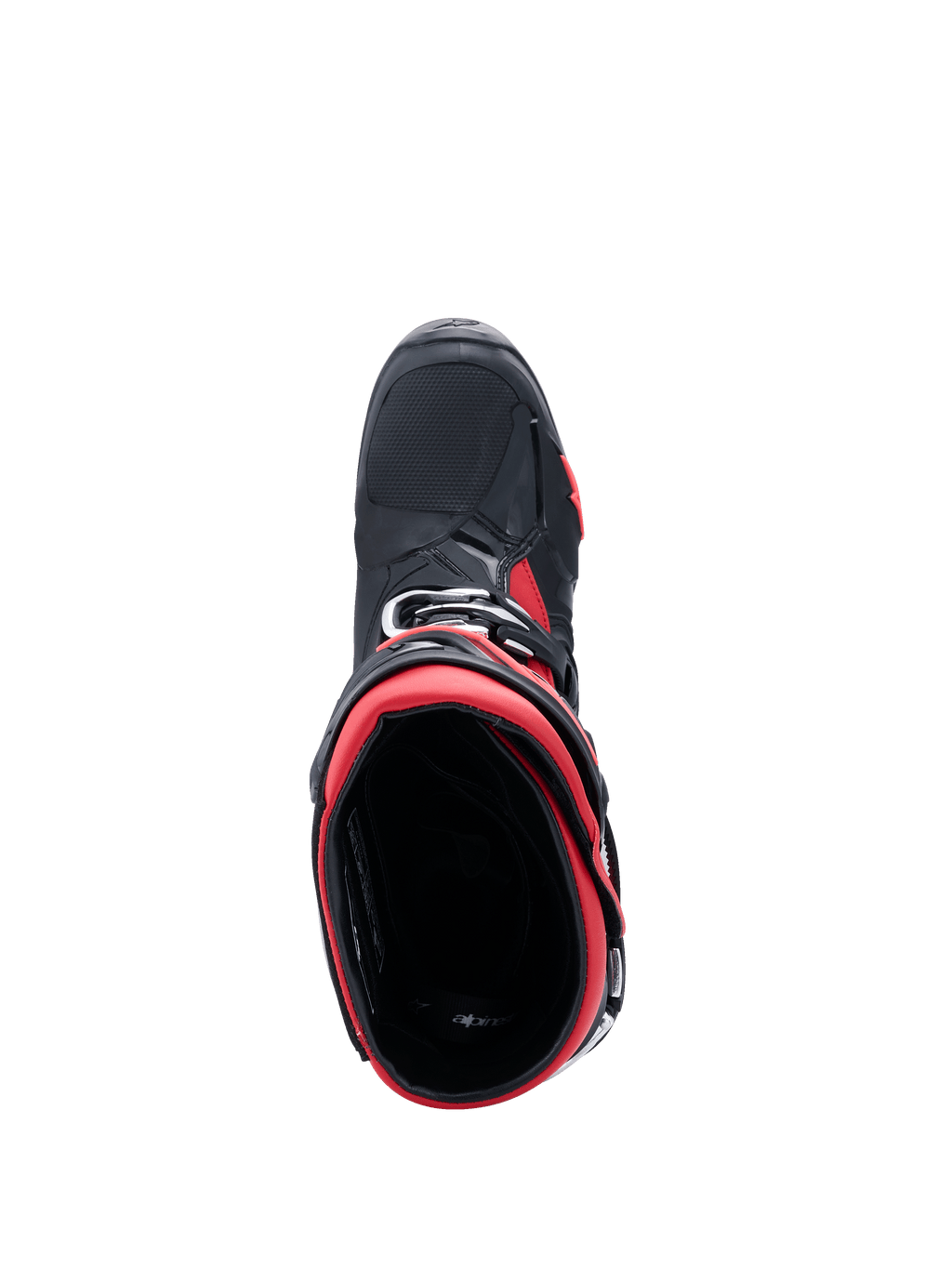 Botas de motocross Alpinestars Tech 10, negro y rojo, vista superior desde arriba hacia la apertura de la bota, destacando el forro interior rojo y el chasis exterior negro con acentos rojos, diseño profesional de equipamiento para todoterreno