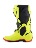 Botas Alpinestars Tech 10, botas de motocross, amarillo flúor, negro y rojo flúor, perfil lateral, construcción en amarillo neón brillante con paneles protectores negros y detalle de la suela en rojo flúor, equipo de alto rendimiento para carreras todoterreno