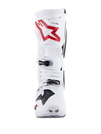 Botas Alpinestars Tech 10 Supervented, blanco y rojo brillante, vista frontal que muestra paneles perforados ventilados, logotipo de estrella roja grande en la placa de la espinilla, hebillas plateadas ajustables y diseño de motocross de alto rendimiento
