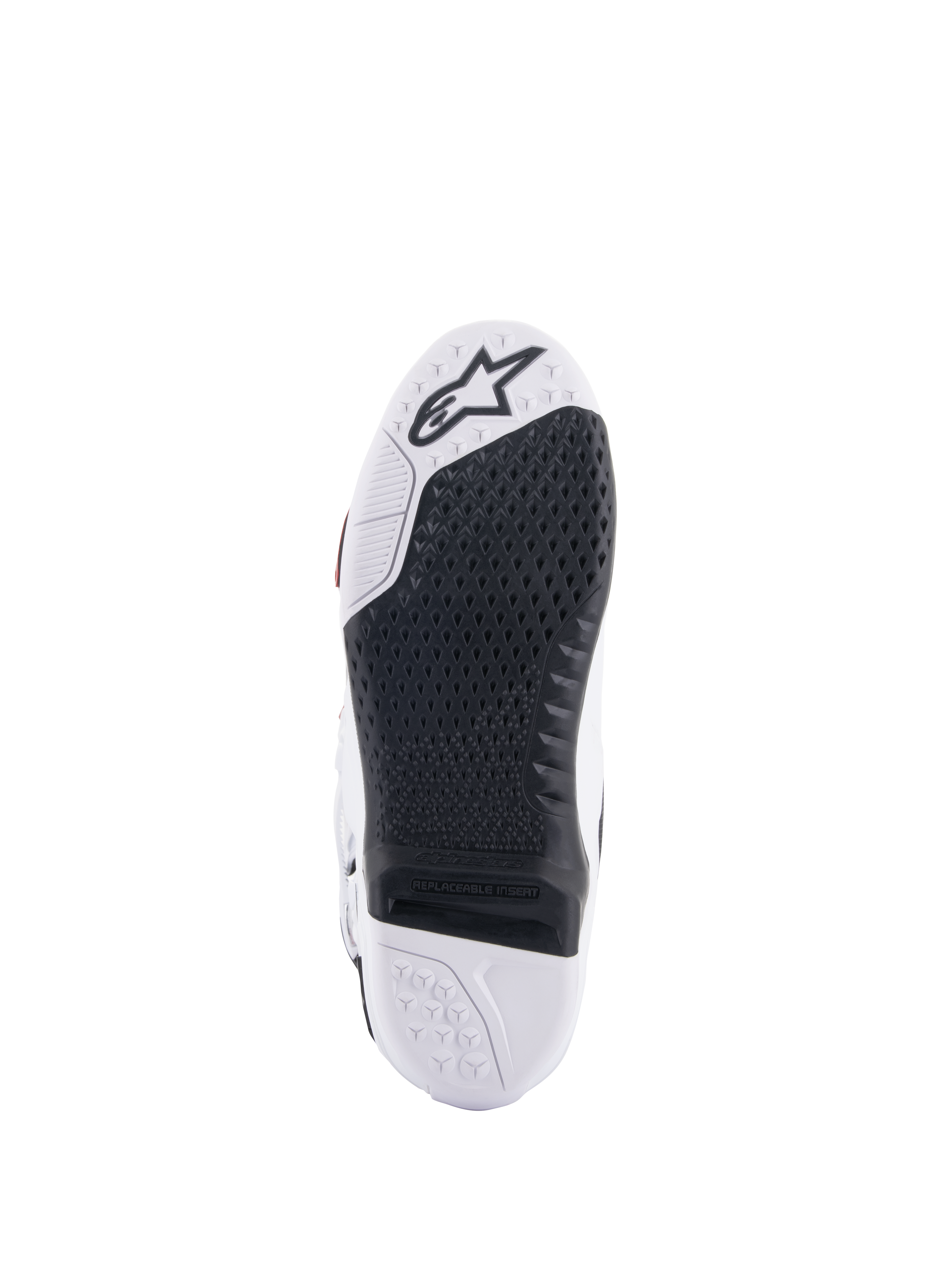 Botas Alpinestars Tech 10 Supervented, vista de la suela blanca y negra, con un diseño de agarre de panal extendido, inserción central reemplazable negra, puntera blanca con el logotipo de la estrella de Alpinestars, optimizada para el control en los estribos de motocross.