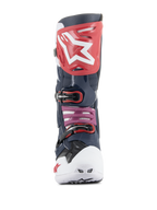 Botas Alpinestars Tech 10 Supervented, botas de motocross, Night Navy White Rainbow, vista frontal con placa de espinilla roja y logo blanco, puntera ventilada blanca y microfibra perforada azul marino para una ventilación máxima.