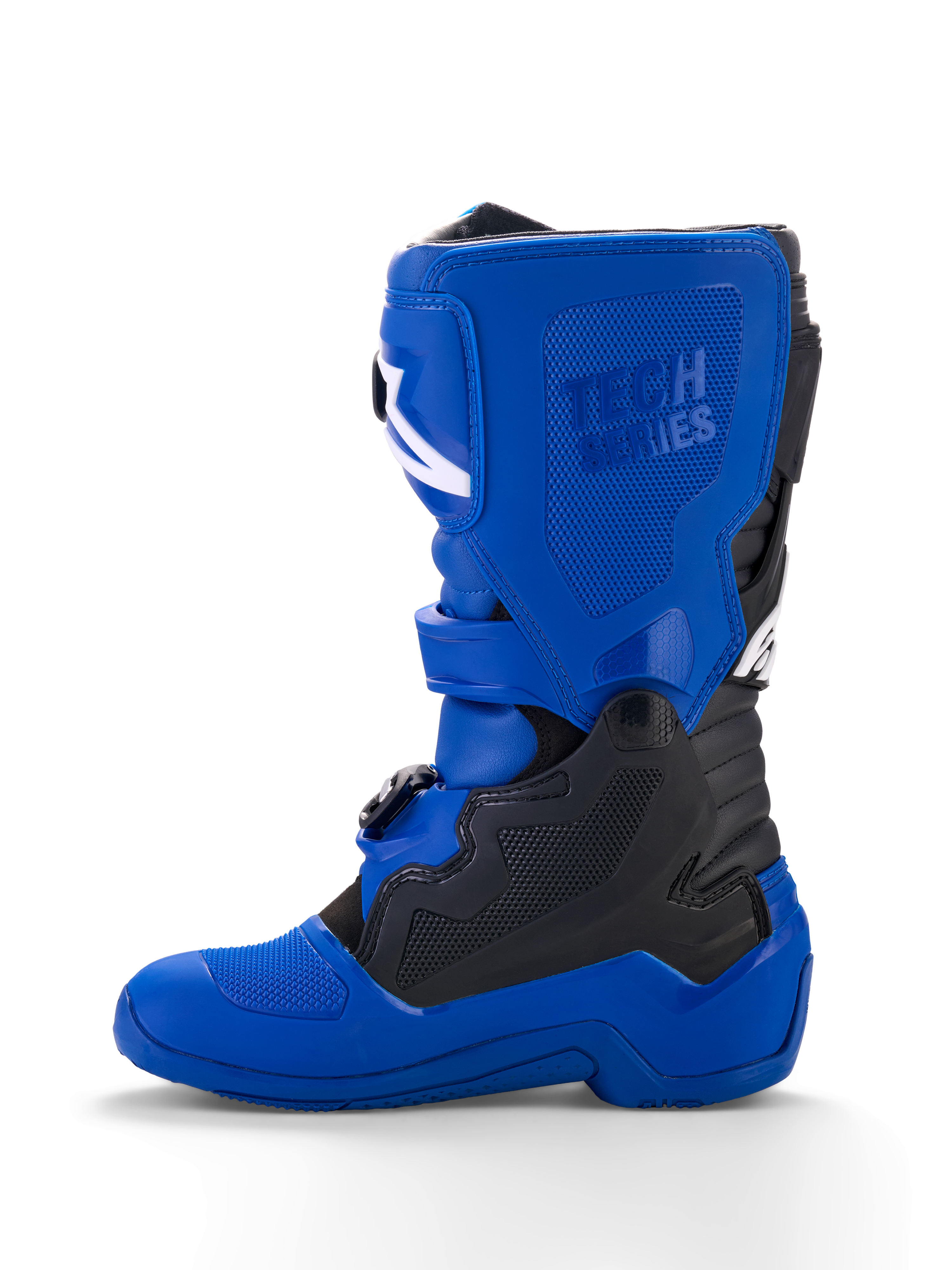 Botas Alpinestars Yamaha Youth Tech 7S, botas de motocross juveniles, azules con detalles en negro y blanco, vista de perfil lateral, con logotipo 'Tech Series' en relieve, paneles protectores de TPU, sistema de cierre de hebillas y suela azul duradera para rendimiento off-road.