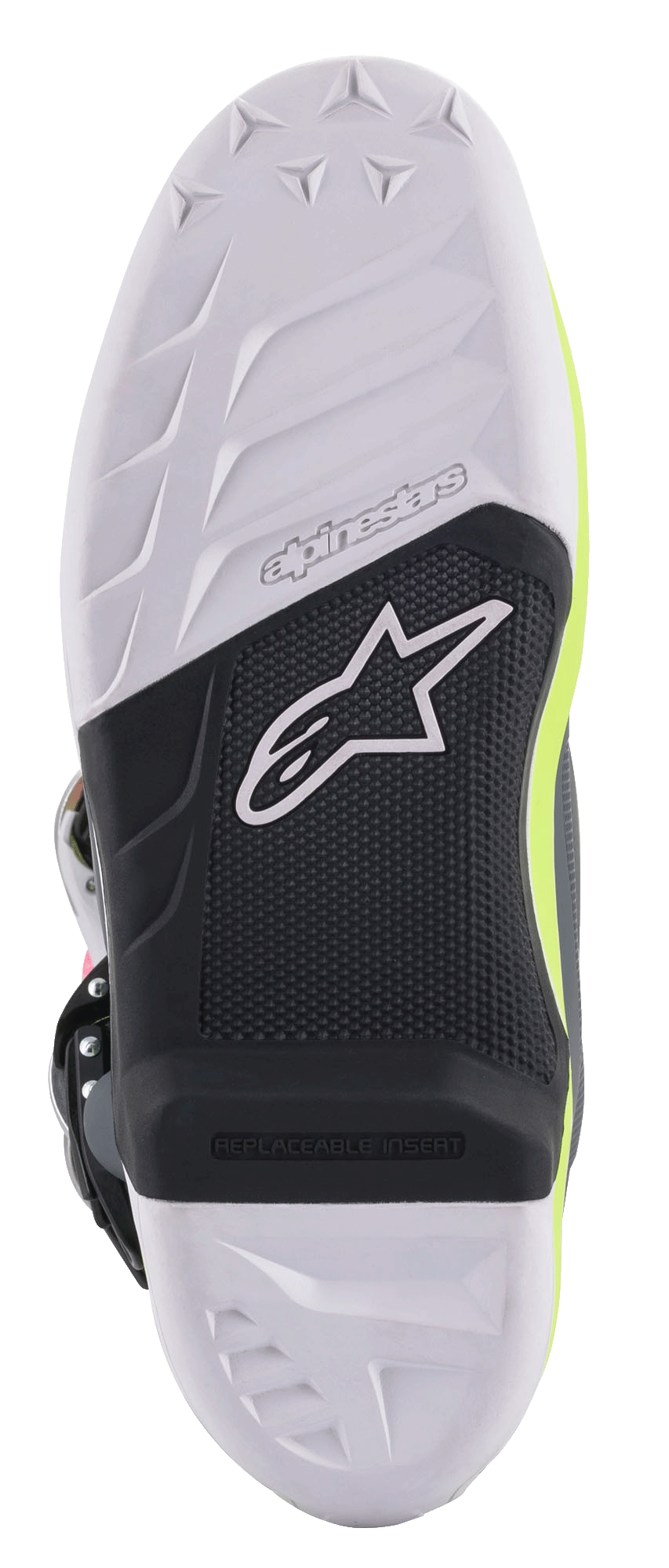 Botas Alpinestars Tech 7, botas de motocross, vista detallada de la suela con un diseño de compuesto en blanco y negro, inserción de estribo reemplazable, agarre texturizado con el logotipo de la estrella de Alpinestars y detalles en amarillo fluorescente