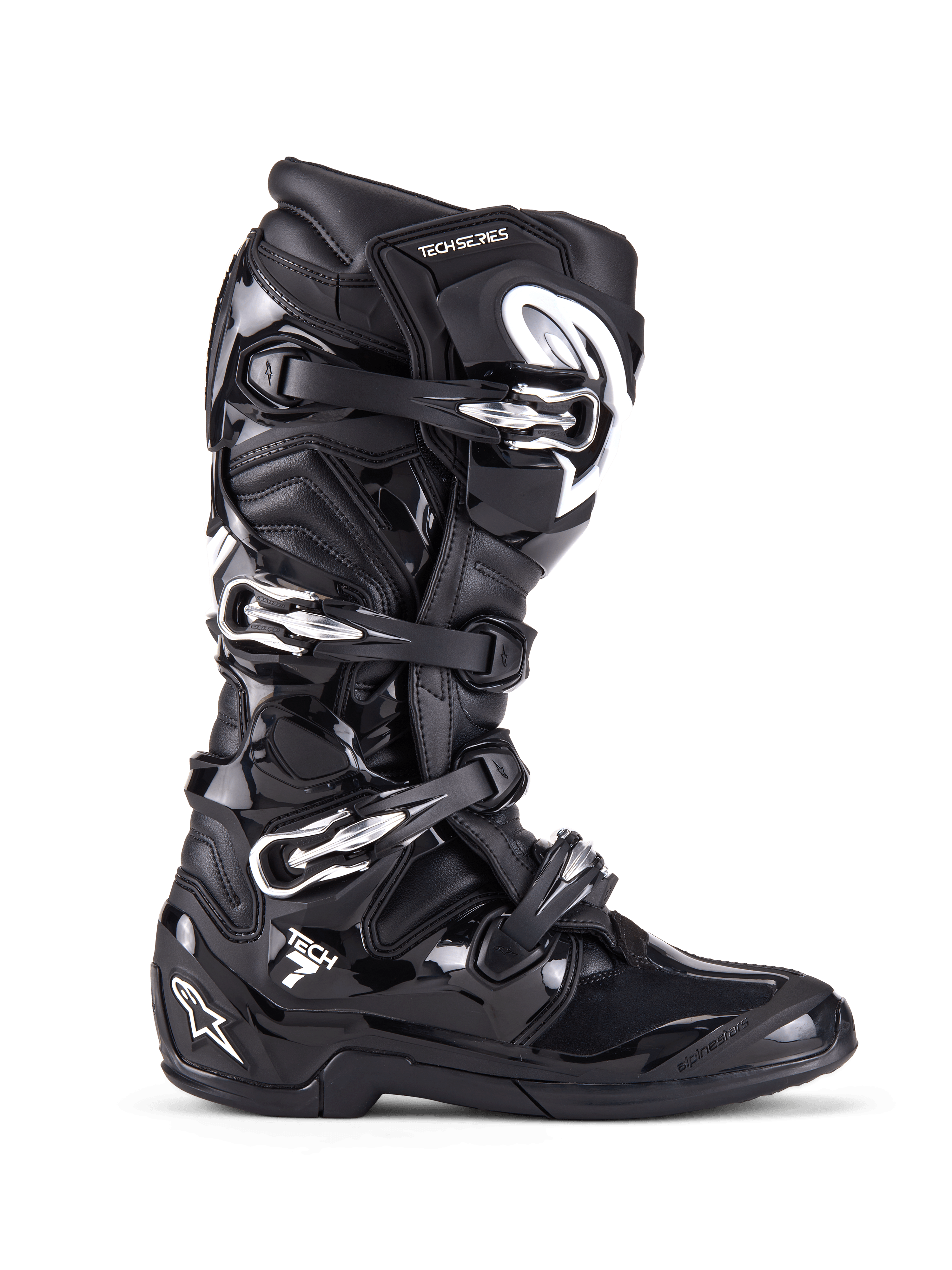 Botas Alpinestars Tech 7, botas de motocross y off-road, negras con hebillas plateadas y detalles blancos, vista de perfil lateral con cuatro hebillas de aluminio de liberación rápida, carcasa de TPU duradera y paneles texturizados para protección off-road