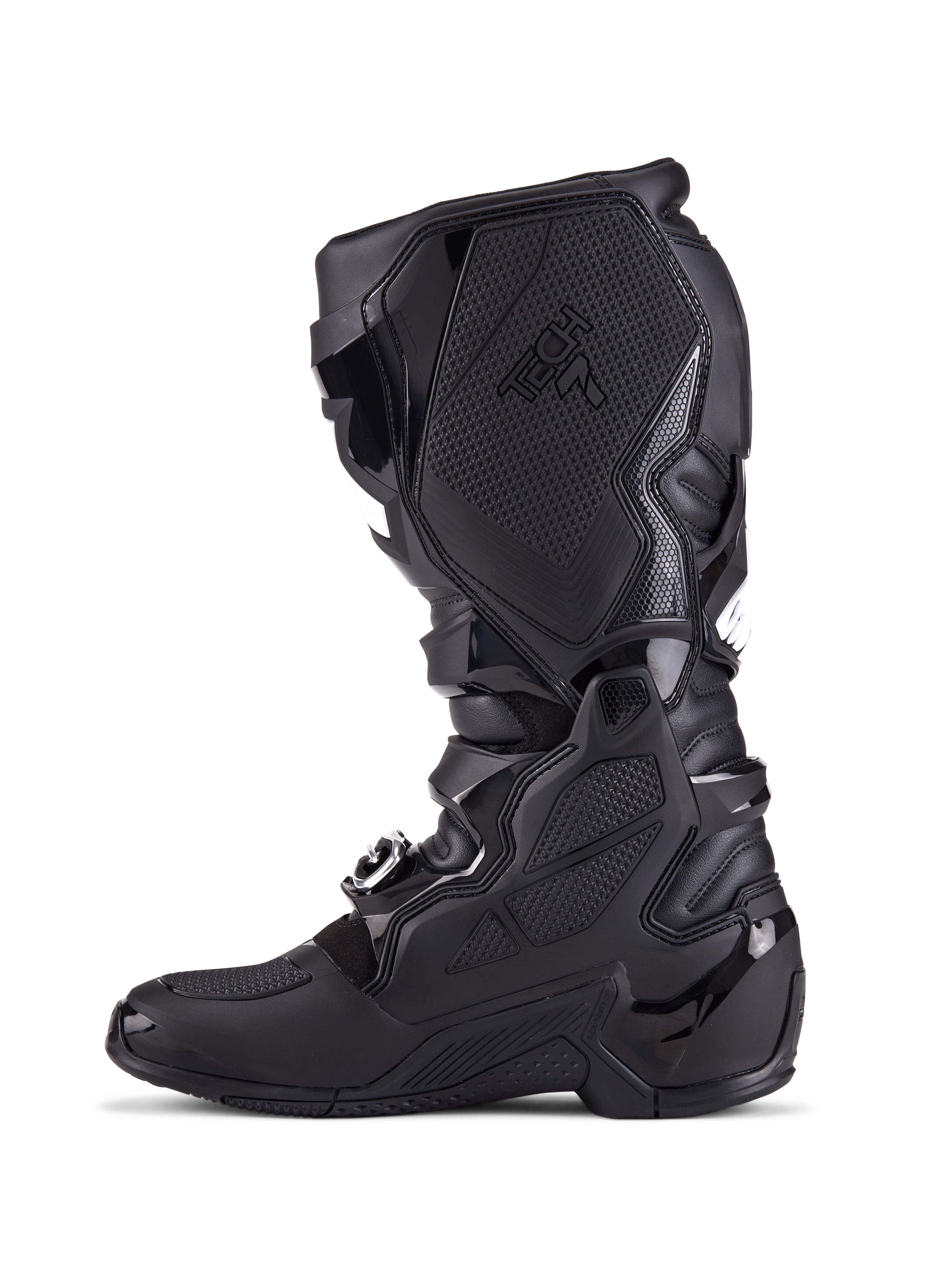 Botas Alpinestars Tech 7, botas de motocross, completamente negras, vista de perfil lateral con placas de protección de TPU, sistema de cierre de hebillas y paneles de agarre texturizados, calzado profesional para conducción off-road