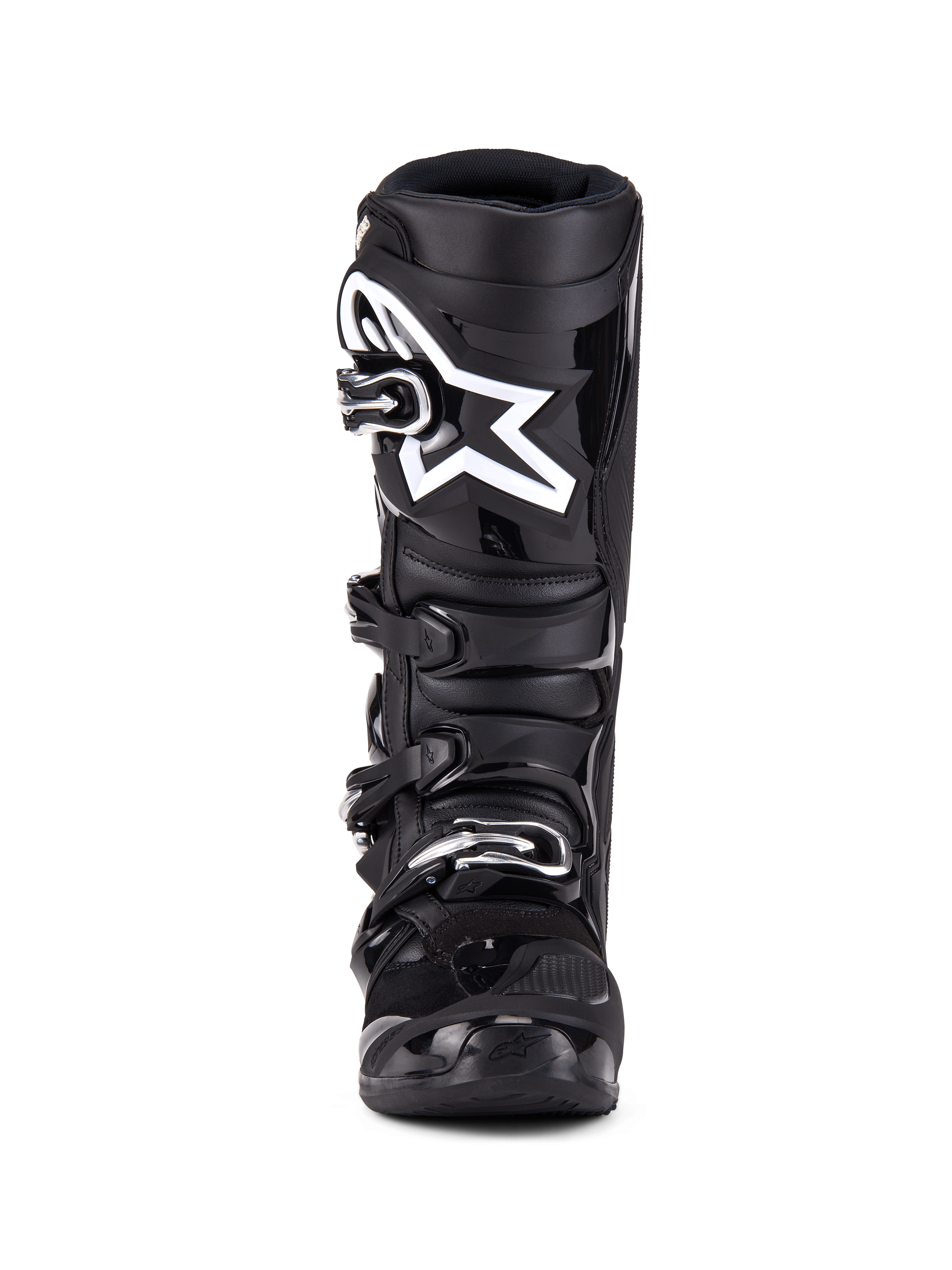 Botas Alpinestars Tech 7, botas de motocross, color negro, vista frontal con sistema de cierre de cuatro hebillas, logotipo de estrella Alpinestars blanco en la placa de la espinilla, carcasa de TPU duradera y protección reforzada para carreras off-road.