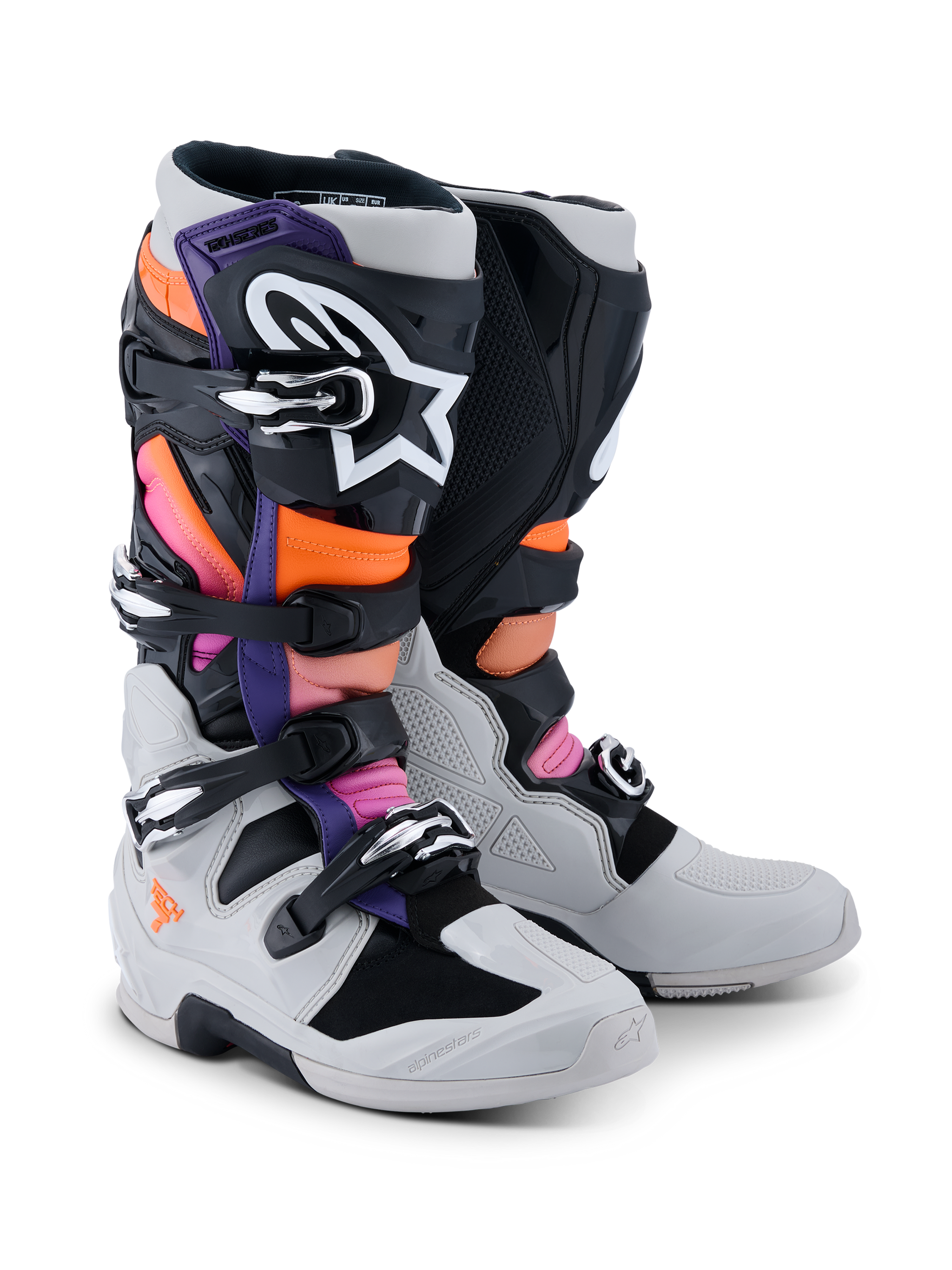 Botas Alpinestars Tech 7, botas de motocross, negro, gris claro, naranja flúor y magenta, con sistema de cierre de hebillas múltiples, carcasa de TPU reforzada y logotipos de alto contraste, diseñadas para competición todoterreno profesional y protección