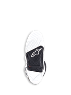 Botas Alpinestars Tech 7, botas de motocross, blancas y negras, vista inferior de la suela de goma vulcanizada de doble compuesto reemplazable con un inserto central negro con el logotipo de Alpinestars y un indicador rojo de límite de desgaste.