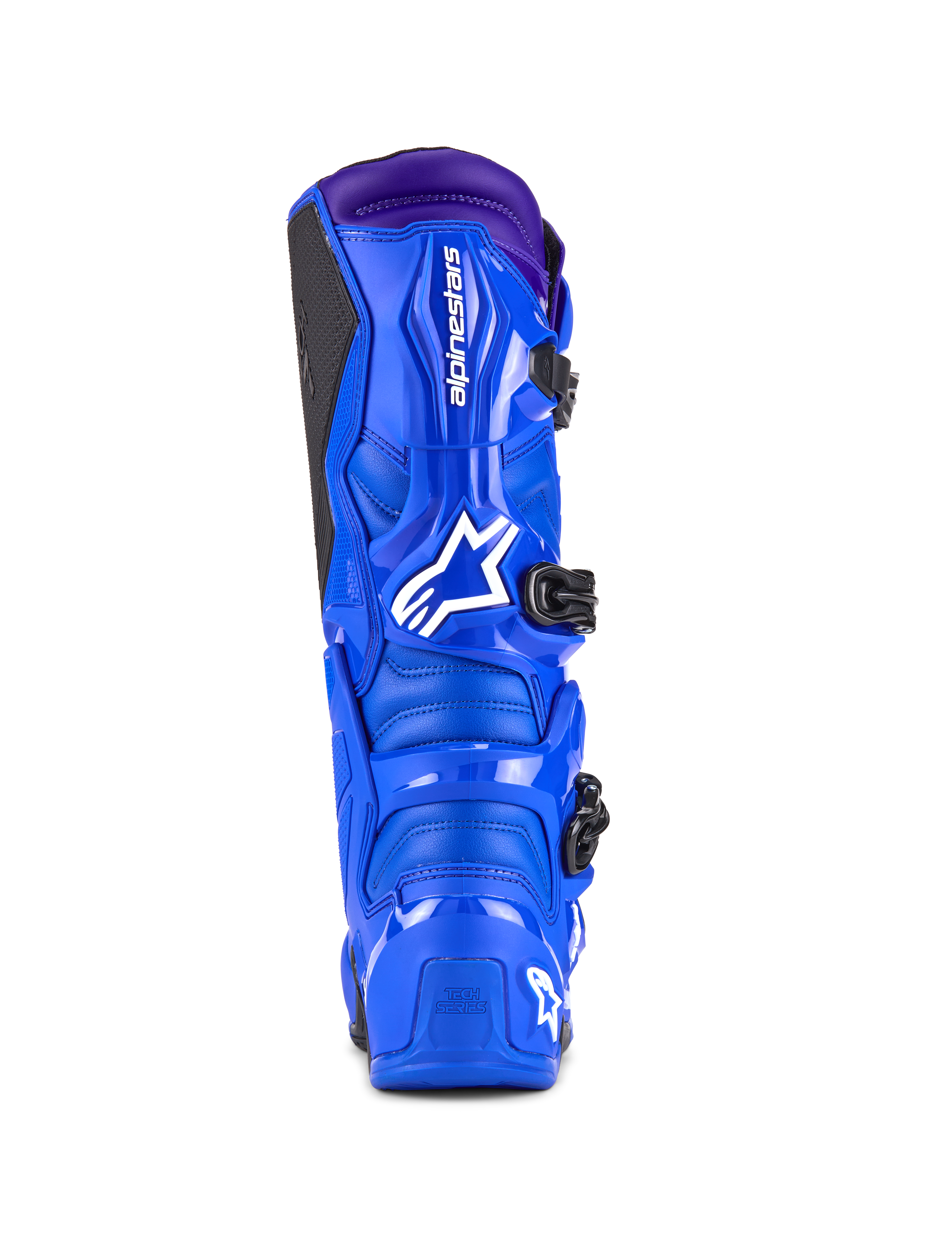 Botas Alpinestars Tech 7, botas de motocross, azul con detalles en púrpura, vista trasera que muestra la protección de TPU, logotipo blanco de Alpinestars en el talón y panel de agarre lateral negro, calzado de alto rendimiento para off-road