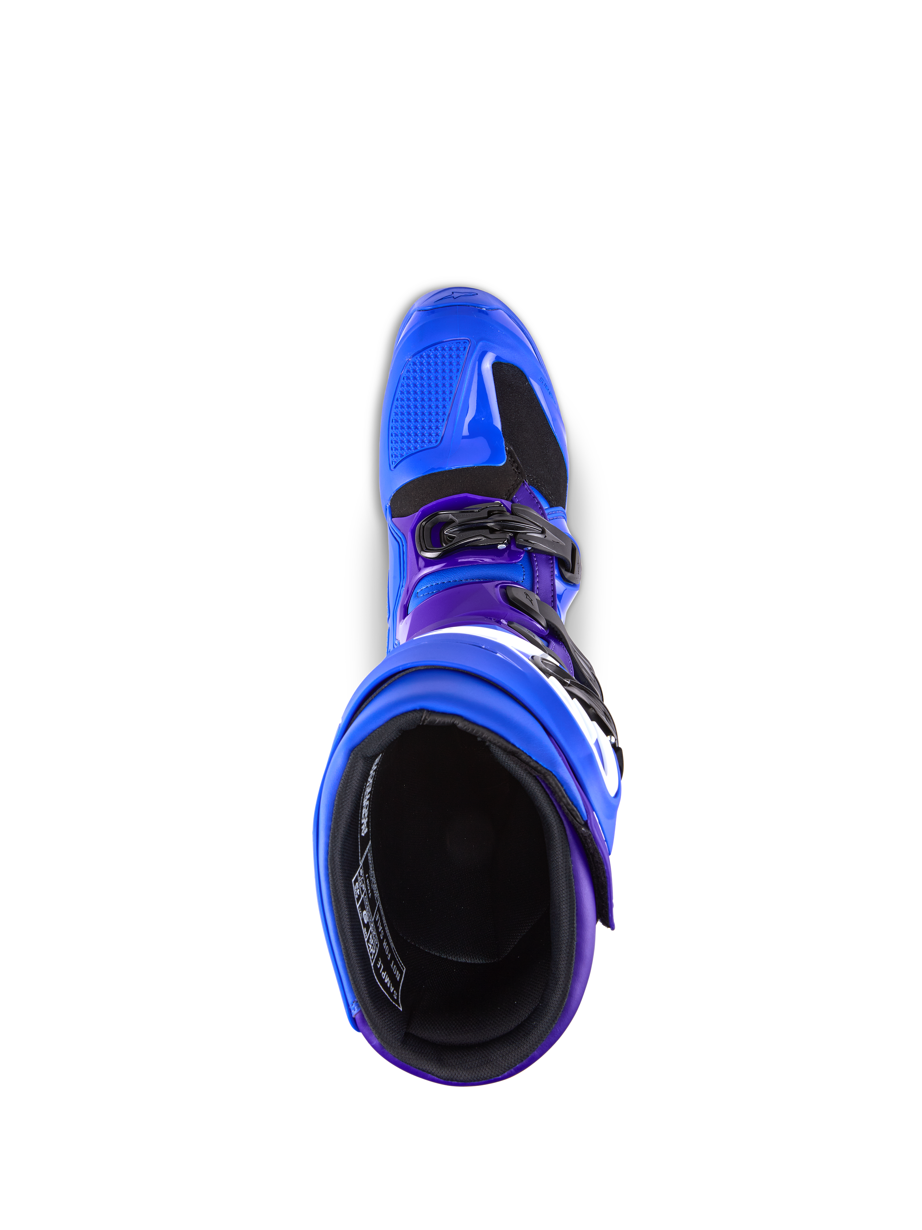 Botas Alpinestars Tech 7, botas de motocross, azules con detalles en púrpura y negro, vista superior que muestra el forro interior y el sistema de hebillas, construcción duradera de TPU y microfibra para rendimiento off-road