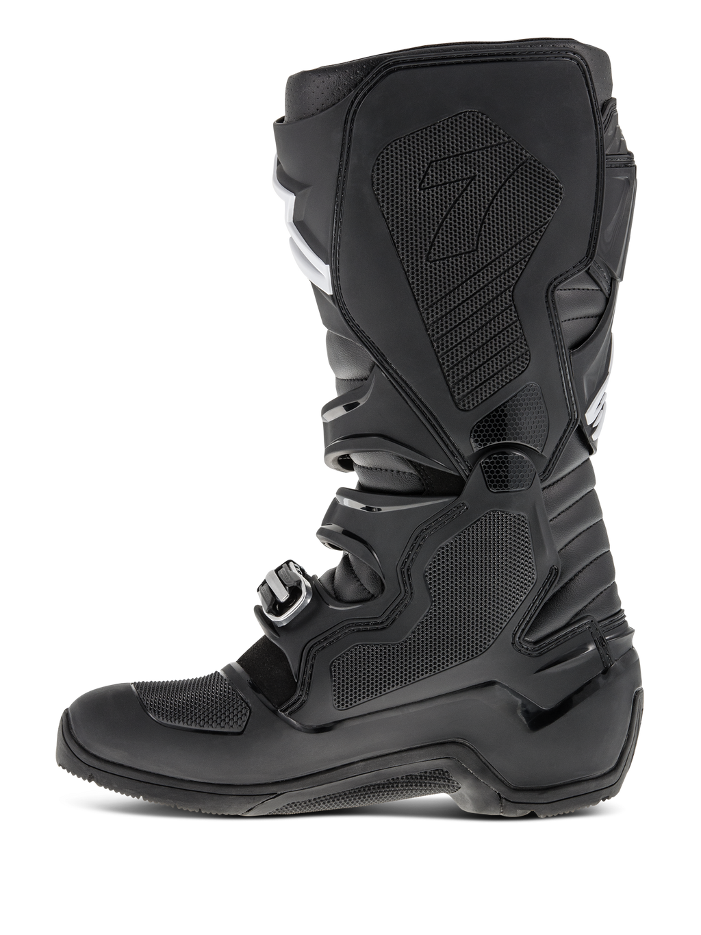 Botas Alpinestars Tech 7 Enduro, Negro, vista de perfil lateral que destaca el lado medial con inserción de goma de panal, paneles protectores de TPU y sistema de cierre de hebillas para rendimiento de motocross todoterreno.