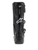 Botas Alpinestars Tech 7 Enduro, negras, vista trasera con el logotipo de Astars en blanco y la marca "Tech 7", carcasa protectora de TPU con sistema de hebillas, construcción duradera para carreras de motocross y todoterreno