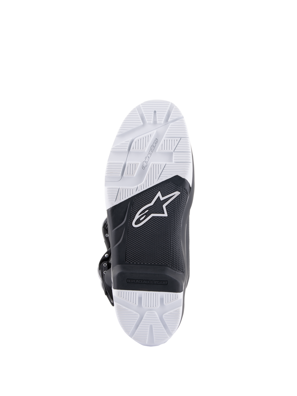 Botas Alpinestars Tech 7 Enduro, vista de la suela que muestra la suela de compuesto diseñada específicamente, diseño bitono en blanco y negro con patrones de agarre texturizados, logo de la estrella blanca e inserto de estribo reemplazable