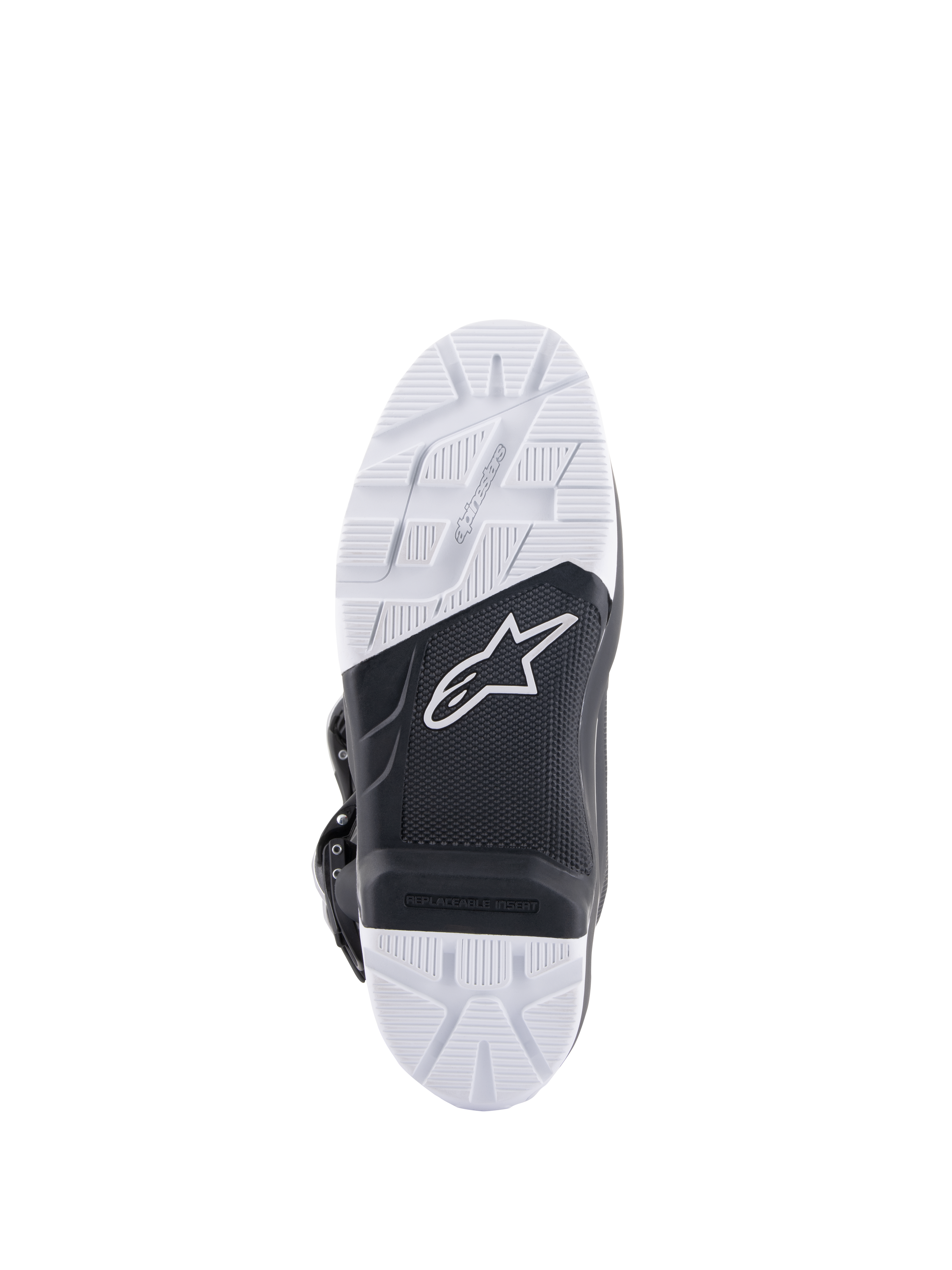 Botas Alpinestars Tech 7 Enduro, vista de la suela que muestra la suela de compuesto diseñada específicamente, diseño bitono en blanco y negro con patrones de agarre texturizados, logo de la estrella blanca e inserto de estribo reemplazable