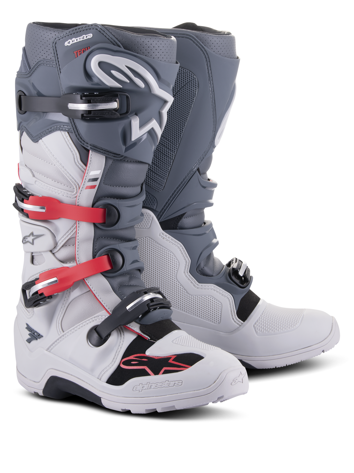Botas Alpinestars Tech 7 Enduro, calzado de motociclismo off-road, gris claro y gris oscuro con acentos en rojo brillante, con sistema de cierre de múltiples hebillas y suela de compuesto robusto diseñada para enduro y trail.