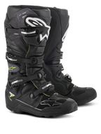 Botas Alpinestars Tech 7 Enduro Drystar®, calzado profesional para motocross y enduro, color negro y gris con logotipos blancos y hebillas plateadas, diseño impermeable y resistente con suelas robustas para rendimiento todoterreno