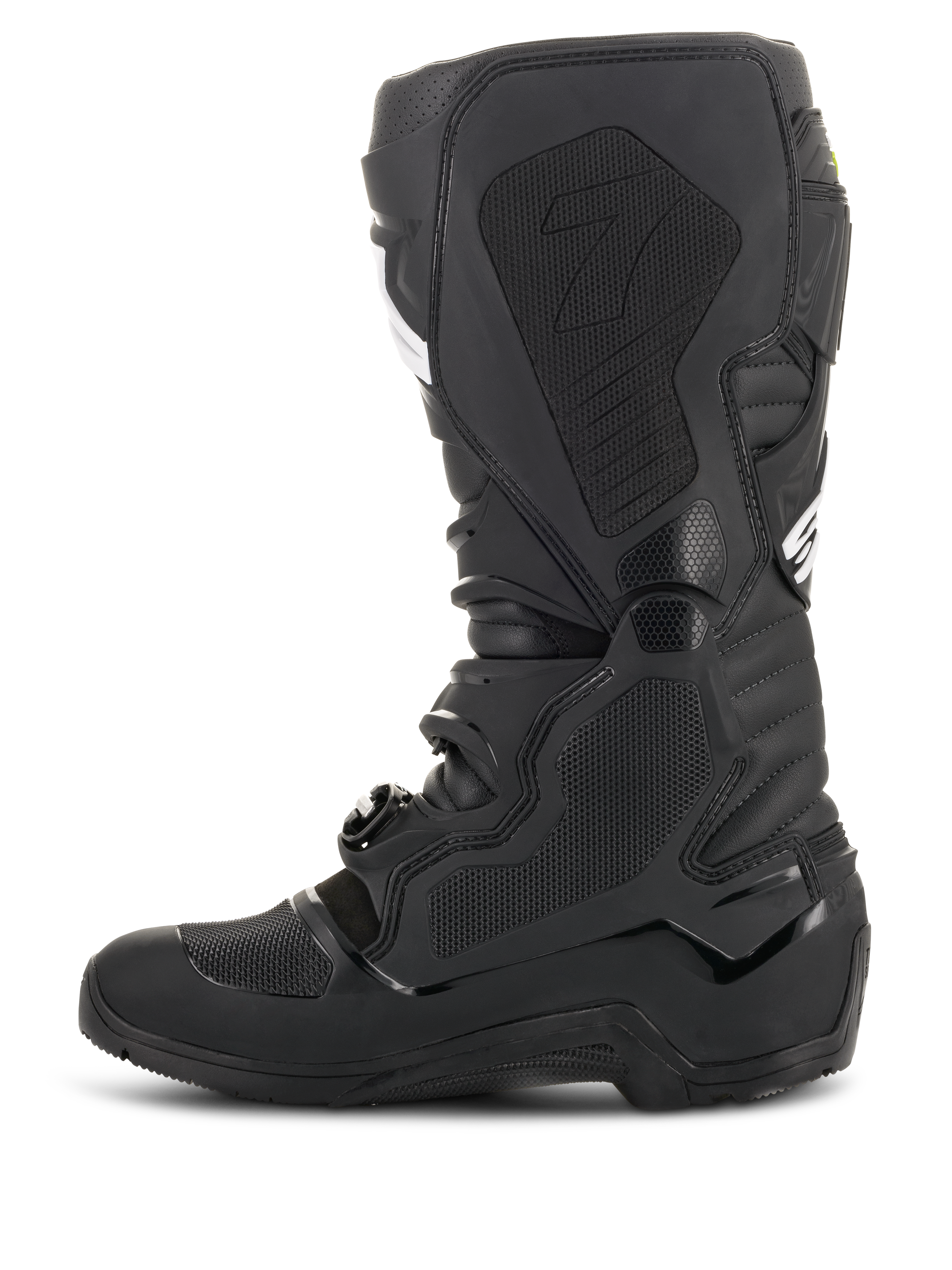 Botas Alpinestars Tech 7 Enduro Drystar®, negras, vista de perfil lateral que muestra el lado medial con paneles de agarre con textura de panal y el logotipo '7', calzado impermeable de motociclismo todoterreno para carreras de enduro