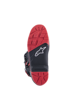Botas Honda Tech 7 Enduro Drystar®, negro y rojo brillante, vista de la suela con patrón de tracción de gran agarre e inserto reemplazable, construcción de goma de doble densidad y logotipo blanco de Alpinestars sobre panel negro texturizado.