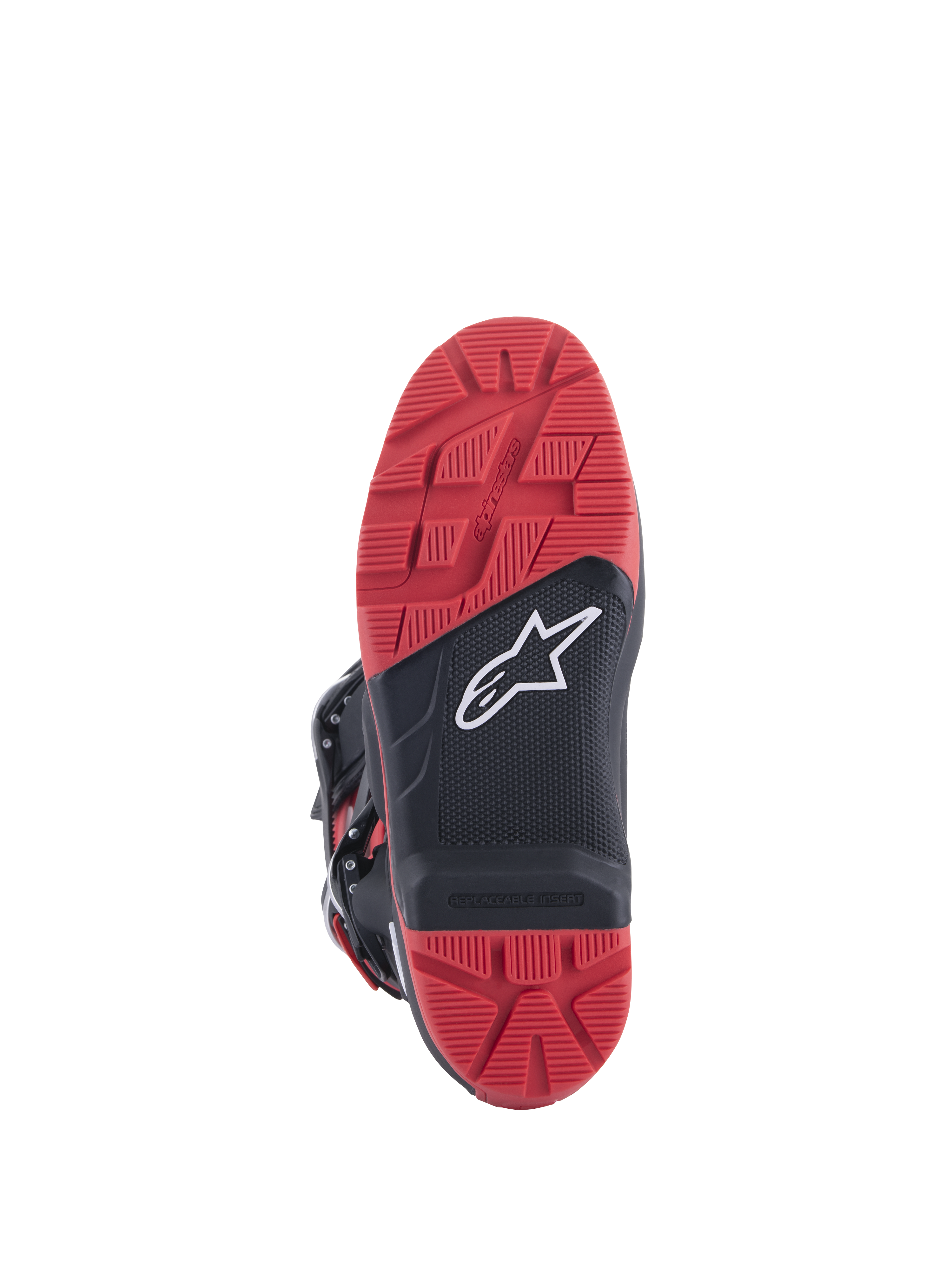 Botas Honda Tech 7 Enduro Drystar®, negro y rojo brillante, vista de la suela con patrón de tracción de gran agarre e inserto reemplazable, construcción de goma de doble densidad y logotipo blanco de Alpinestars sobre panel negro texturizado.