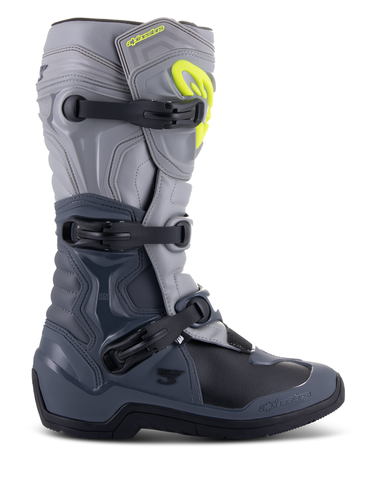 Botas Alpinestars Tech 3, botas de motocross, gris oscuro, gris claro y negro, vista lateral con tres hebillas de polímero negras, paneles de protección de TPU y un logotipo de Alpinestars amarillo vibrante en la zona superior de la espinilla