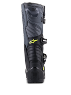 Botas Alpinestars Tech 5, botas de motocross, negro, gris frío y amarillo flúor, vista trasera que muestra las zonas de flexión en acordeón y protección en el talón, con logotipo Astars amarillo y marca Tech Series en relieve, construcción duradera de múltiples materiales para rendimiento todoterreno