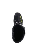 Botas Alpinestars Tech 5, vista superior, negro con logotipo amarillo fluo en la puntera, mostrando el forro interior y el cierre de hebilla, calzado de alto rendimiento para motocross y off-road