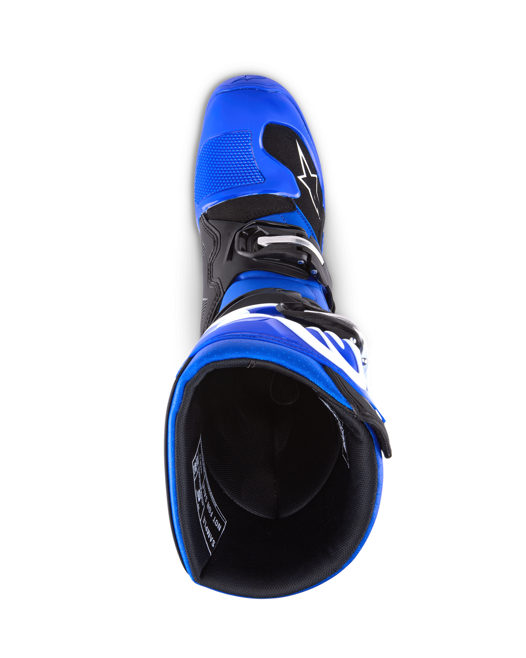 Botas Alpinestars Youth Tech 7 S, botas de motocross, azul, negro y blanco, vista superior mirando al interior de la bota, que muestra la carcasa exterior azul y el forro negro, construcción duradera con logotipos blancos para motocross juvenil