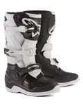 Alpinestars Youth Tech 7S Boots, Motocross Boots, Black and White, featuring adjustable buckle closure system, TPU shin guard and pivot system, durable construction with thick patterned soles for off-road riding