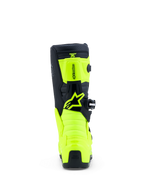 Alpinestars botas Tech 7S juvenil para motocross, amarillas fluo y negras, vista trasera con paneles de TPU y logo Astar