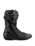 Botas Alpinestars Supertech R, botas de alto rendimiento para carreras de motos, completamente negras, vista de perfil lateral que muestra el protector de espinilla de TPU, deslizador de punta reemplazable y talón reforzado, diseño profesional listo para la pista
